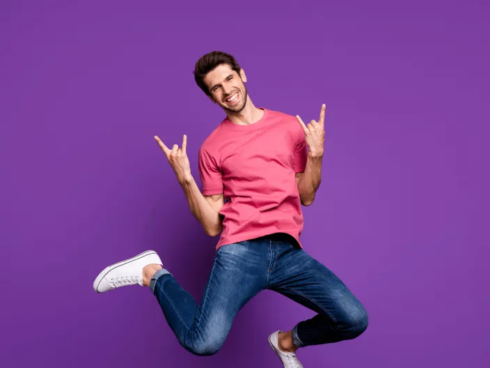 Young man smiling and jumping